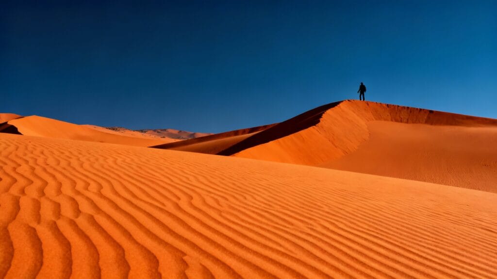 Dunes orange et ciel bleu, chaleur sèche en octobre
